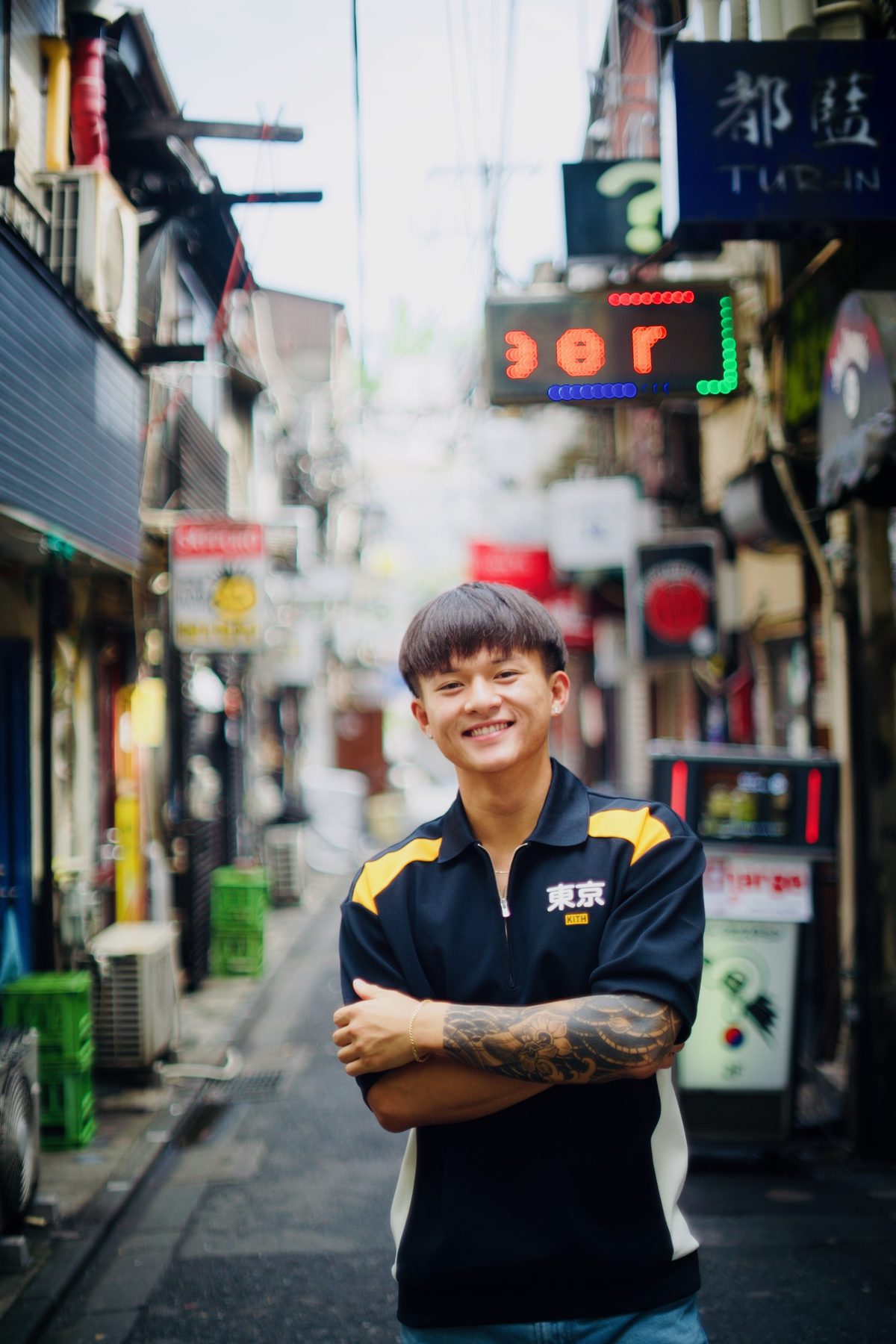 A young man photographed in a Golden Gai alley