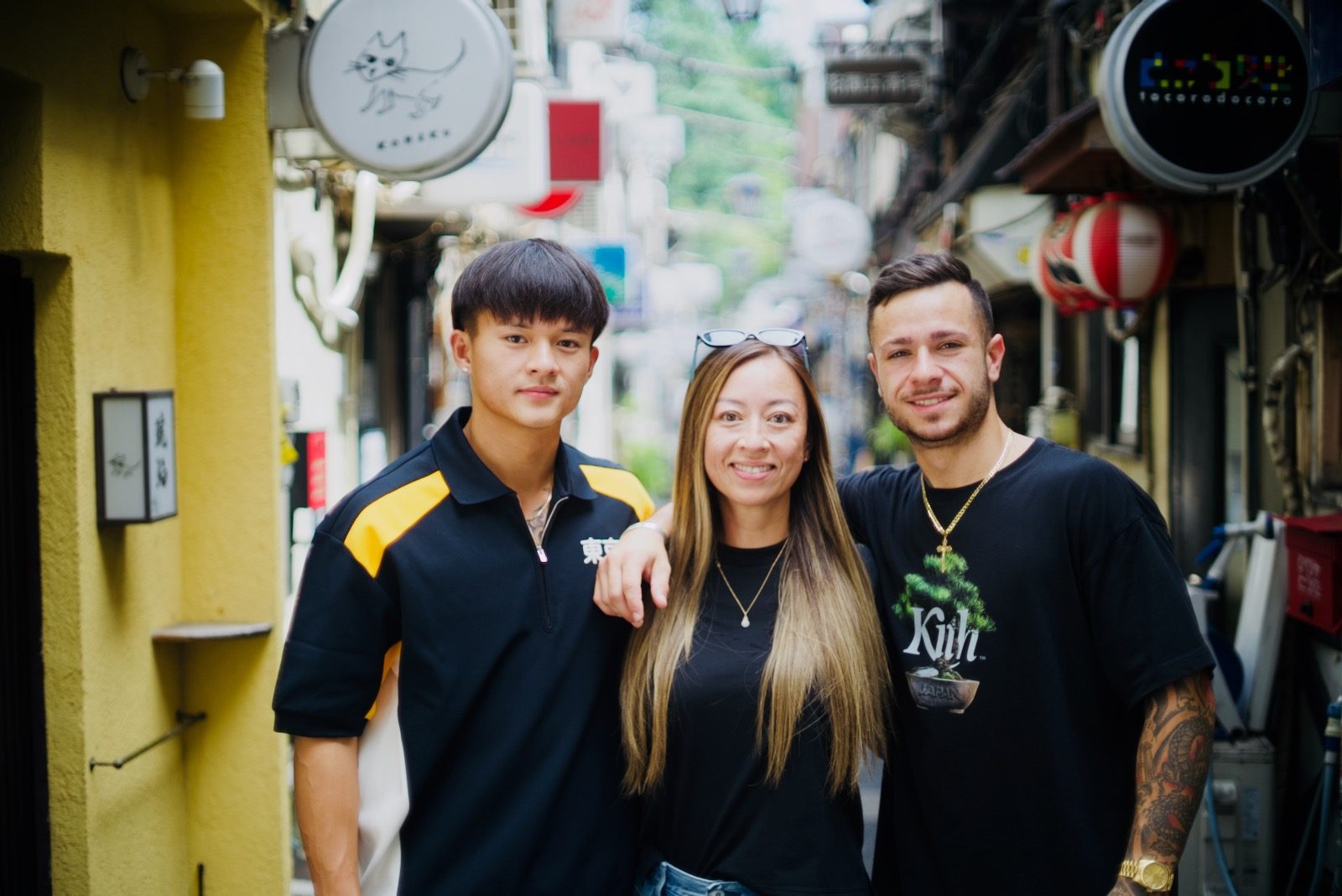 A family walking through the lanes of Golden Gai
